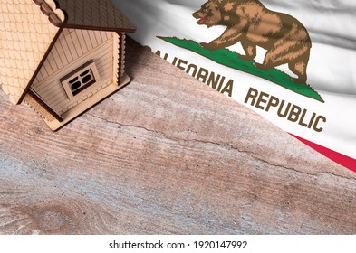 House Model Near California Flag. Real Estate Sale And Purchase Concept. Space For Text.