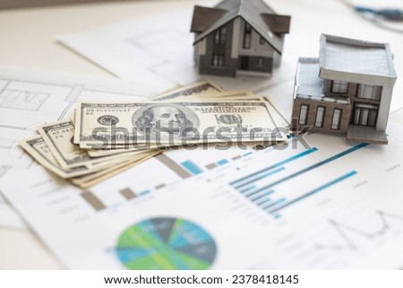 House model on 100 US dollar bills. Keep money or investment for building a new house