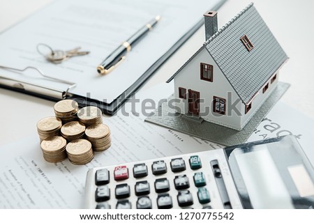 House model with real estate agent and customer discussing for contract to buy house, insurance or loan real estate background.