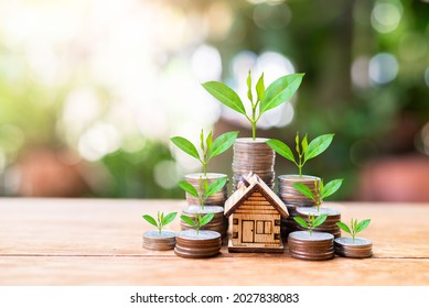 house model set with money coins saving for concept investment mortgage finance and home loan refinance