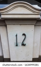 House Number 12 On An Elegantly Carved Stone Lintel