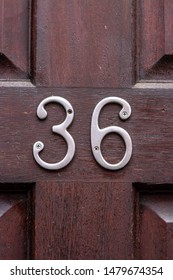 House Number 36 On A Redwood Door