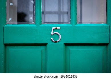 House Number 5 On A Green Wooden Front Door