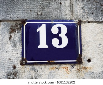 House Number Thirteen (13).House Number Thirteen (13).Unlucky House Number Thirteen On A Wall.

