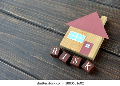 House object with wooden blocks with risk word - Shutterstock ID 1880651602
