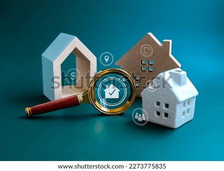 House online search, Property value, home buying and selling, real estate investment concepts. Home and and valuable research icons in magnifying glass with three types of house on blue background.