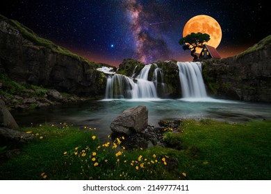 House over waterfall with starry sky and moon - Powered by Shutterstock