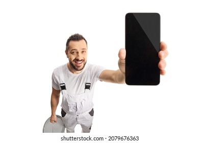 House painter holding a smartphone in front of camera isolated on white background