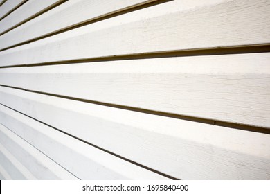 House With Pale Yellow Vinyl Siding