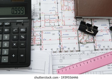 House Plans With Calculator For Costing Estimate. 
Free Estimates Card.
Architect With Blueprint And Calculator Estimating Project Cost.