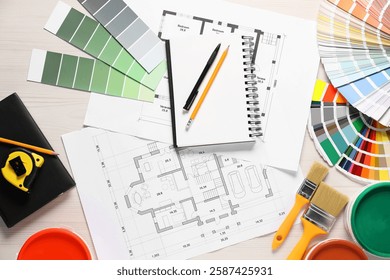 House plans and different decorator's tools on white wooden table, flat lay