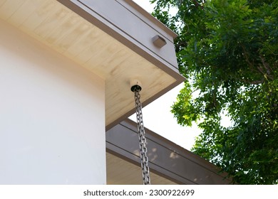 House rain gutter. Rain chains