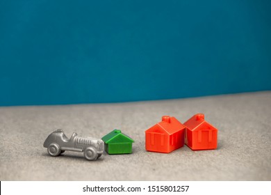 The House Is Red And Green With A Gray Car Standing Next To It, The Concept Of A Rich Man