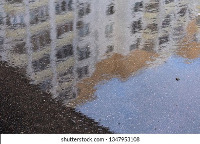house reflection in a puddle