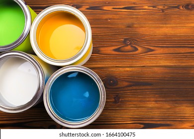 House renovation, paint cans on the old wooden background with copy space - Powered by Shutterstock