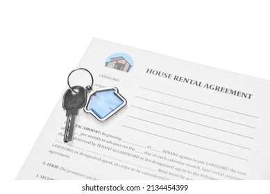 House Rental Agreement And Key With House Shaped Keychain On White Background, Closeup