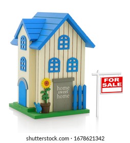 House for sale. Model of wooden two-storey house. Maquette of idylic country house. Isolated on white background with shadow reflection. With clipping (vector) path. Real estate theme. Selling a house - Shutterstock ID 1678621342