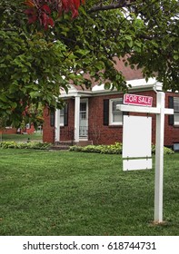 House For Sale With For Sale Sign On Lawn