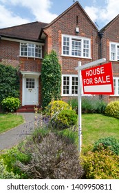 House For Sale Sign Outside A Typical UK Semi-detached House In London