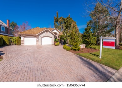 House For Sale In Vancouver, Canada. Real Estate Sign In Front Of A House.