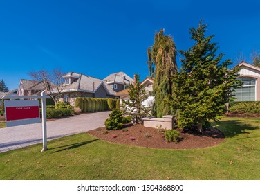 House For Sale In Vancouver, Canada. Real Estate Sign In Front Of A House.