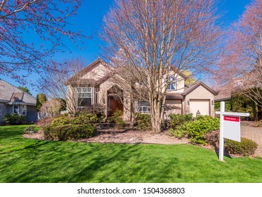 House For Sale In Vancouver, Canada. Real Estate Sign In Front Of A House.