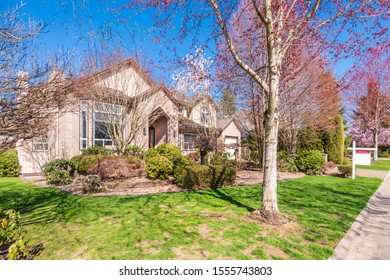 House For Sale In Vancouver, Canada. Real Estate Sign In Front Of A House.