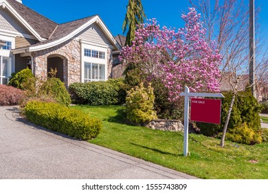 House For Sale In Vancouver, Canada. Real Estate Sign In Front Of A House.