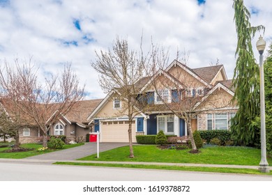 House For Sale In Vancouver, Canada. Real Estate Sign In Front Of A House.