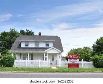 House For Sale White Picket Fence Suburban Home Residential Neighborhood Blue Sky Clouds USA