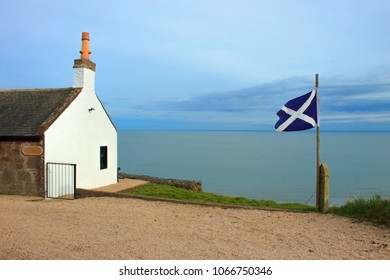 House With Sea View And Scottish Flag. St Cyrus, Aberdeenshire, Scotland, UK. 