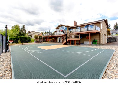 House With Sport Court And Patio Area. View Of Green Court