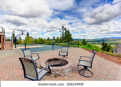 House With Sport Court And Patio Area. View Of Fire Pit With Chairs