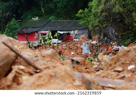 A house stands damaged by a landslide caused by heavy rains in the southeastern coast of Guaruja, Sao Paulo state, Brazil. [[stock_photo]] © 
