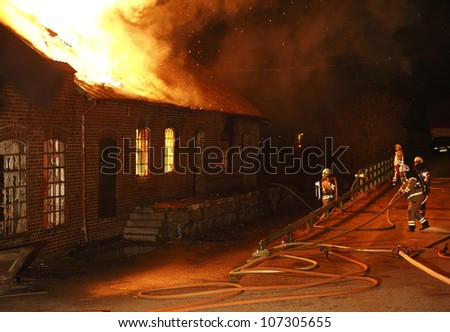 A house in Sweden burning down.