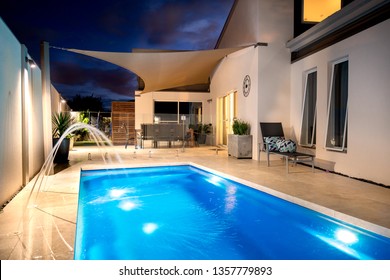 House with swimming pool and water feature