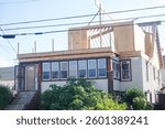 House that is in the process of having a second floor built onto it.