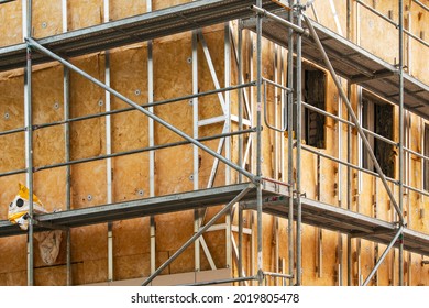 House Thermal Insulation Mineral Wool Slabs. Outside Wall Heat Isolation With Mineral Wool, Building Under Construction 