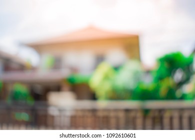 House And Tree Blurry Background.For Home Business Contracting Or Agreement And Home Warranty Image.
