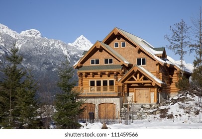 A House Typical Of West Coast Architechture, Sits Against The Backdrop Of The Tantalus Range In Squamish, British Columbia.