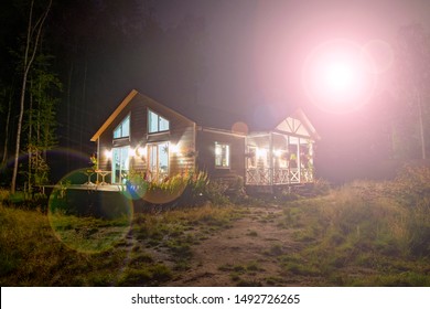 House Under Construction With Beautiful Lighting, Bright Illumination From The Back Of The Frame. Overexposed Picture, Landscape. Glare, Rays And Light From The Zoom.