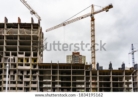 House under construction, monolithic construction, high crane