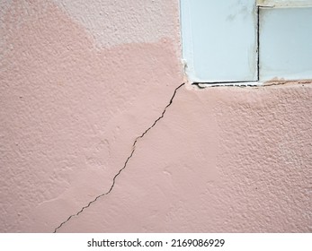 House Wall Crack Near Window Frame. Closeup Photo, Blurred.