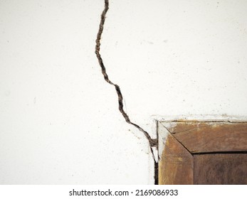 House Wall Crack Near Window Frame. Closeup Photo, Blurred.