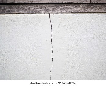 House Wall Crack Near Window Frame. Closeup Photo, Blurred.