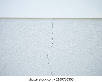 House Wall Crack Near Window Frame. Closeup Photo, Blurred.