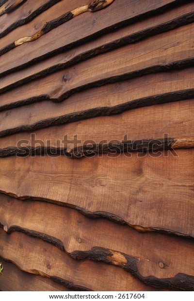 House wall made of raw\
wood