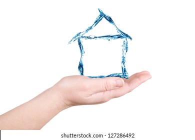 The House And Water On A Palm On A White Background