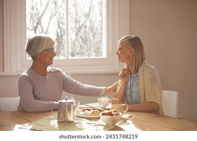 House, woman and daughter visit mom in kitchen with food for breakfast, tea and snacks with senior. Female person, smile and happiness with mother in family home, elderly and girl in dining room - Powered by Shutterstock