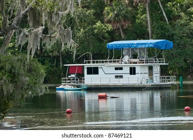 Houseboat Anchored At Silver Glen Springs Which Is A Natural Spring In Sunny Florida.